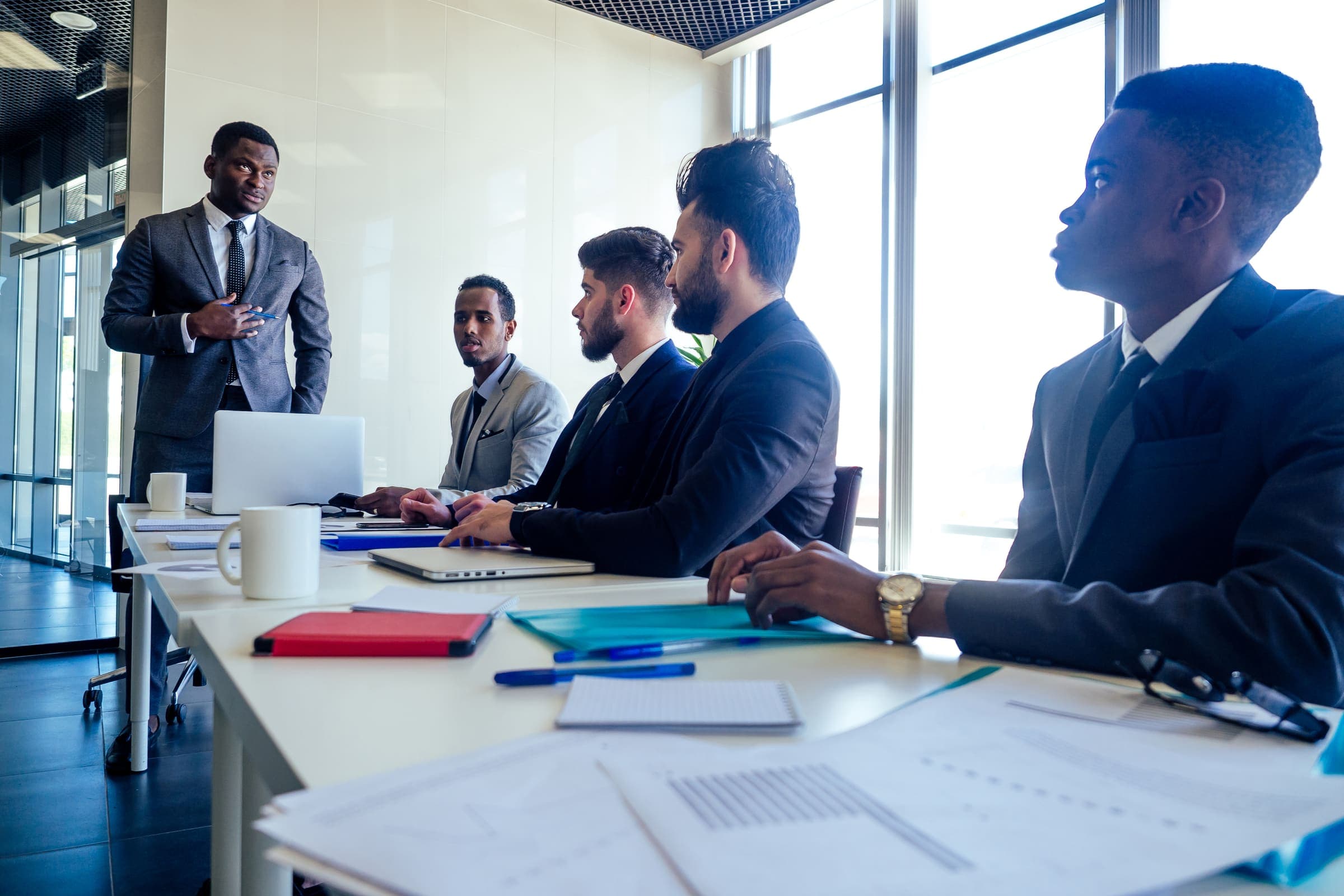 Professionals in a training and assessment discussion meeting